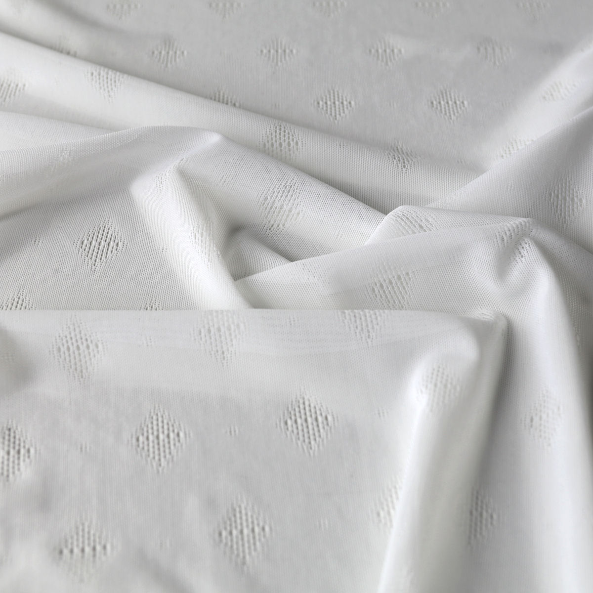 Creme Netzstoff mit Rautemuster und elastische Creme Netzstoff mit Rautemuster und elastische